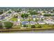 An aerial view showcasing a community with many similar homes near a road at 1167 Saint Tropez Ct, Kissimmee, FL 34759