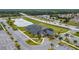 An aerial view of the clubhouse with palm trees and a nearby roadway at 1167 Saint Tropez Ct, Kissimmee, FL 34759