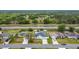 Aerial view of a neighborhood showcasing well-maintained homes and verdant surroundings at 1167 Saint Tropez Ct, Kissimmee, FL 34759