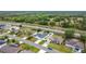 Aerial view featuring a residential street with lovely single-Gathering homes and green spaces at 1167 Saint Tropez Ct, Kissimmee, FL 34759