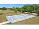 Outdoor community basketball court with fencing and surrounding green space at 1167 Saint Tropez Ct, Kissimmee, FL 34759
