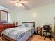 Bedroom with wood floors and warm paint at 1167 Saint Tropez Ct, Kissimmee, FL 34759