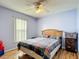 Cozy bedroom with natural light and wood floors at 1167 Saint Tropez Ct, Kissimmee, FL 34759