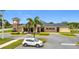 Community clubhouse with stone accents, mature landscaping, and ample parking at 1167 Saint Tropez Ct, Kissimmee, FL 34759