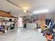 This garage includes storage shelving and washer/dryer hookup at 1167 Saint Tropez Ct, Kissimmee, FL 34759