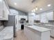 Well-lit kitchen showcasing granite countertops, stainless appliances, and ample cabinet space at 1167 Saint Tropez Ct, Kissimmee, FL 34759