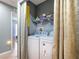 This laundry room includes a washer and dryer hook up with shelving at 1167 Saint Tropez Ct, Kissimmee, FL 34759