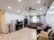 Comfortable living room featuring a large sectional sofa and modern entertainment center at 1167 Saint Tropez Ct, Kissimmee, FL 34759