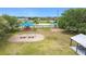 Community playground featuring swings, slides, picnic shelter, and lush landscaping in a well maintained community at 1167 Saint Tropez Ct, Kissimmee, FL 34759