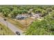Aerial view showcases home's location on a spacious lot with lush greenery at 1226 Pine St, Orlando, FL 32824