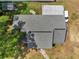 Aerial view showcases the home's roof, driveway, and surrounding landscaping and neighborhood at 1226 Pine St, Orlando, FL 32824