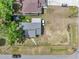 Aerial view showcases the home's roof, driveway, and surrounding landscaping and neighborhood at 1226 Pine St, Orlando, FL 32824