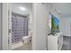 Bathroom featuring a shower with geometric patterned curtain and a classic white sink vanity at 1226 Pine St, Orlando, FL 32824