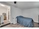 A simple bedroom features a single bed with hardwood floors and bright, natural lighting at 1226 Pine St, Orlando, FL 32824