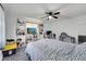 Bright bedroom features wood flooring, a ceiling fan, and ample storage with built-in shelves at 1226 Pine St, Orlando, FL 32824