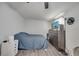 Cozy bedroom with a comfortable bed, dresser, and neutral color scheme at 1226 Pine St, Orlando, FL 32824
