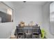 Charming dining area with dark wood table set and natural light at 1226 Pine St, Orlando, FL 32824