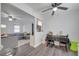 Open dining area and living room space, complete with modern lighting and vinyl floors at 1226 Pine St, Orlando, FL 32824