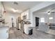 Open kitchen with stainless steel appliances and adjacent living room at 1226 Pine St, Orlando, FL 32824