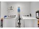 Functional laundry room featuring modern washer and dryer units at 1226 Pine St, Orlando, FL 32824