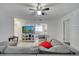 Bright living room features a large sectional, TV, and a view of kitchen, creating an inviting atmosphere at 1226 Pine St, Orlando, FL 32824