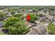 Aerial view of a house nestled in a residential area with mature trees and landscaping at 1345 Tindaro Dr, Apopka, FL 32703