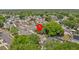 Aerial view of a house with trees and landscaping in a residential area at 1345 Tindaro Dr, Apopka, FL 32703