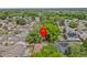 Aerial view of a charming home surrounded by lush trees in a tranquil neighborhood at 1345 Tindaro Dr, Apopka, FL 32703