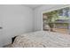 Bedroom with a view, featuring a bed, window, and natural sunlight at 1345 Tindaro Dr, Apopka, FL 32703
