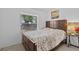 Cozy bedroom featuring a comfortable bed, side table and natural light at 1345 Tindaro Dr, Apopka, FL 32703