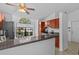 Bright kitchen featuring stainless steel appliances and tiled floors at 1345 Tindaro Dr, Apopka, FL 32703