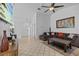 Bright living room with neutral tile flooring and comfortable sectional sofa at 1345 Tindaro Dr, Apopka, FL 32703