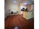 Cozy dining area features hardwood floors, a stylish bar area, and a breakfast bar at 14341 Fredricksburg Dr # 1016, Orlando, FL 32837