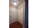 Functional entryway featuring two entry doors, a closet for storage, and hardwood floors at 14341 Fredricksburg Dr # 1016, Orlando, FL 32837