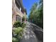 Exterior view showing sidewalk alongside building and trees at 14341 Fredricksburg Dr # 1016, Orlando, FL 32837