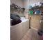 Well-organized laundry room with shelving, ample storage, and tile flooring at 14341 Fredricksburg Dr # 1016, Orlando, FL 32837