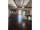 Spacious living room featuring dark wood floors, recessed lighting, and open layout perfect for entertaining at 14341 Fredricksburg Dr # 1016, Orlando, FL 32837
