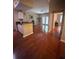 Bright living room featuring gleaming hardwood floors and access to a private outdoor patio at 14341 Fredricksburg Dr # 1016, Orlando, FL 32837