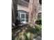 Cozy, screened-in patio area with lush garden and outdoor seating at 14341 Fredricksburg Dr # 1016, Orlando, FL 32837