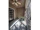 Enclosed porch with tiled floor, fan, and ample natural light perfect for relaxing or potted plants at 14341 Fredricksburg Dr # 1016, Orlando, FL 32837