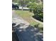 Well-maintained sidewalk leading to a community with manicured lawns and mature trees at 14341 Fredricksburg Dr # 1016, Orlando, FL 32837
