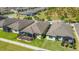A beautiful home features a screened-in lanai and is surrounded by lush green landscaping at 164 Montoro Ln, Davenport, FL 33837
