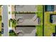 An aerial view reveals the property's roofline and features of the backyard landscaping and the surrounding neighborhood at 164 Montoro Ln, Davenport, FL 33837