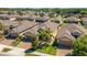 A beautifully landscaped property with a well-maintained lawn and a spacious two-car garage at 164 Montoro Ln, Davenport, FL 33837