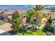Aerial view of a home showcasing mature landscaping, green lawn, and brick driveway at 164 Montoro Ln, Davenport, FL 33837