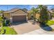 Attractive home with a lush front lawn, a brick driveway, and mature landscaping at 164 Montoro Ln, Davenport, FL 33837