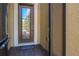 Close-up of an elegant front door featuring decorative glass and dark trim at 164 Montoro Ln, Davenport, FL 33837