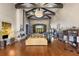 Elegant lounge with soaring ceilings, exposed beams, a stone fireplace, and comfortable seating at 164 Montoro Ln, Davenport, FL 33837