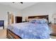 Comfortable main bedroom with a decorative bed, soft bedding, and en-suite bathroom access at 164 Montoro Ln, Davenport, FL 33837