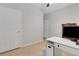 Bright office space with white desk and tile floors, illuminated by natural light at 164 Montoro Ln, Davenport, FL 33837